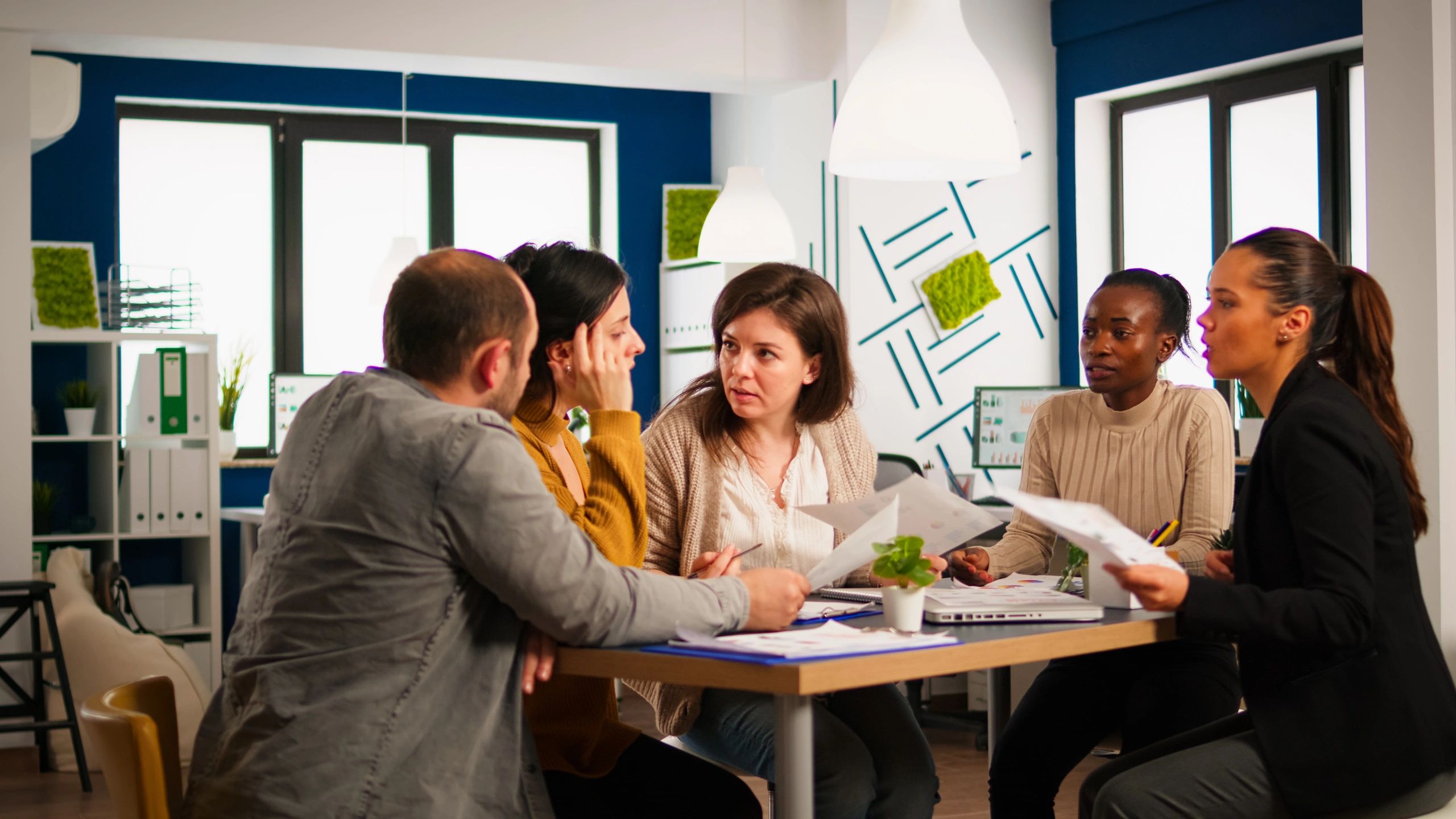 Team member collaborating in office strategy session