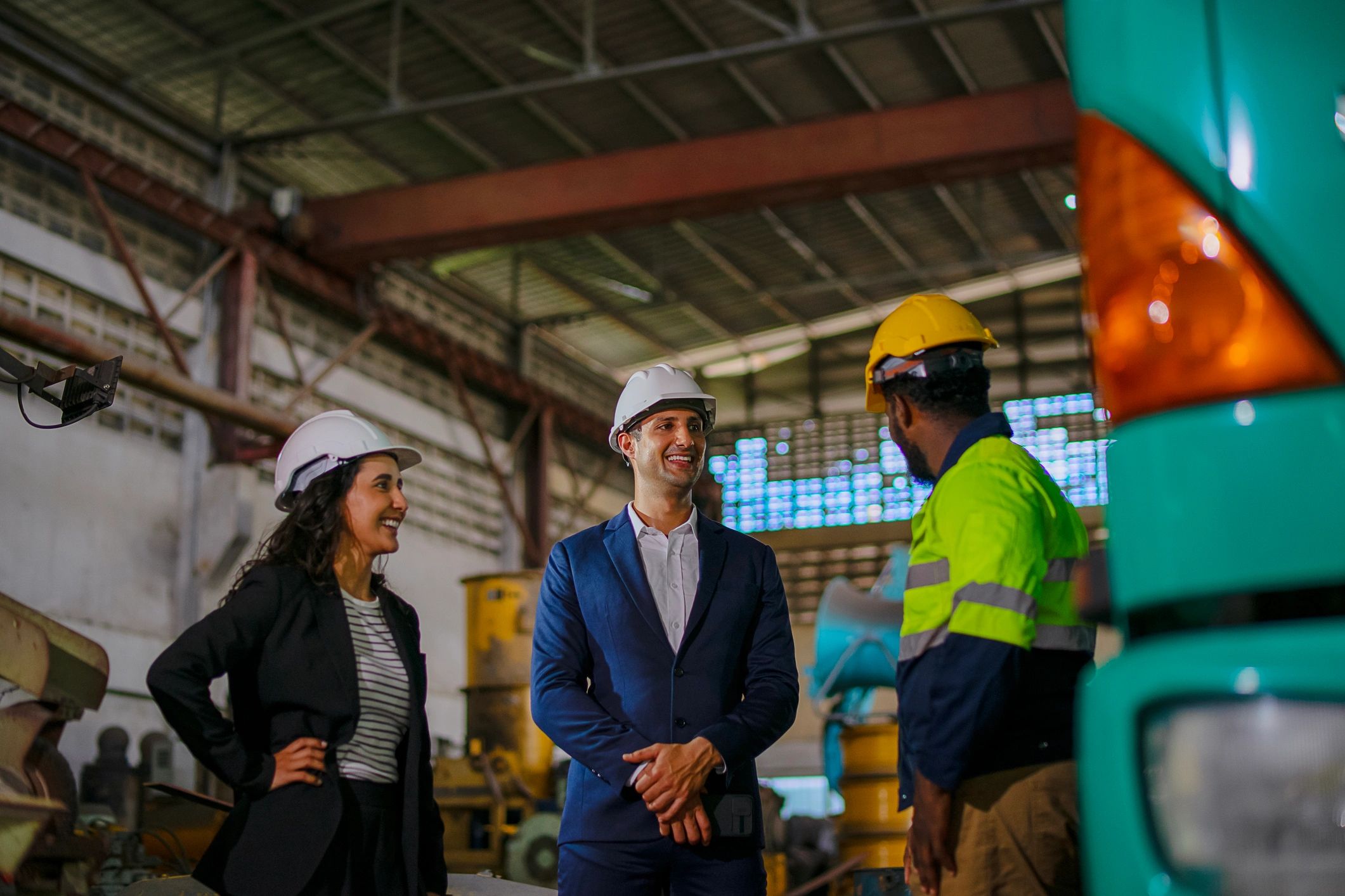 Engineer and business professional meeting at a construction site